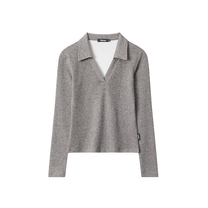 Clara – Polo cintré, élégance et confort intemporels, ajusté avec manches longues.