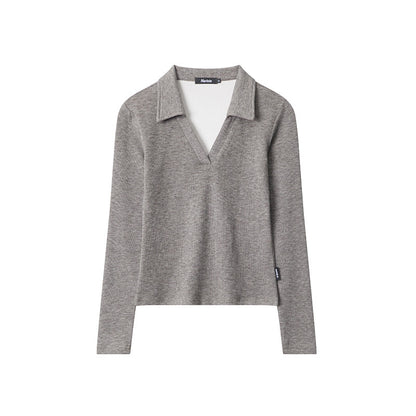 Clara – Polo cintré, élégance et confort intemporels, ajusté avec manches longues.